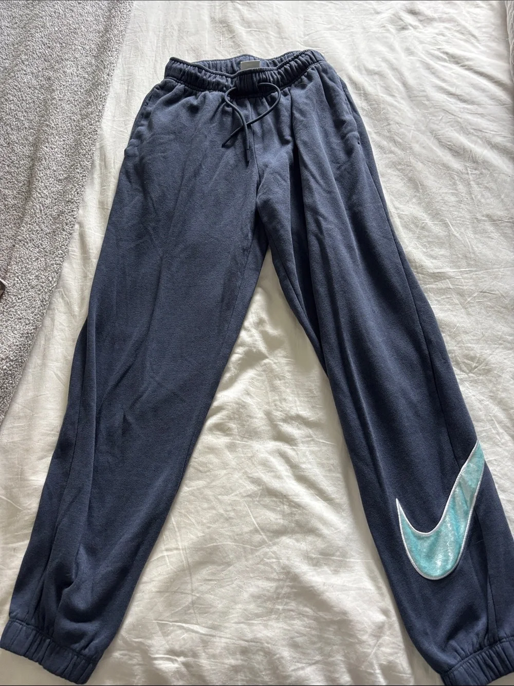 Nike Navy Track Joggers with Teal Swoosh Accent